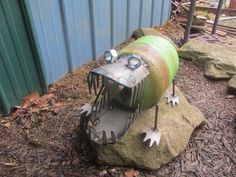 a large metal object sitting on top of a rock