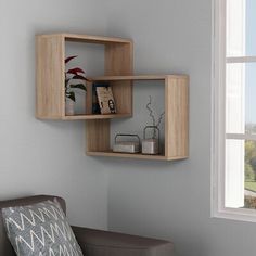 a living room with a chair and some shelves on the wall