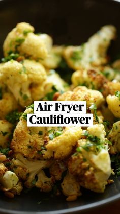 cauliflower with herbs and seasoning in a black bowl