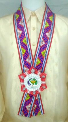 a man's white shirt with a red and blue ribbon around his neck