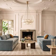 a living room filled with furniture and a fire place