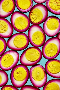 sliced up radishes on a blue background with yellow and pink highlights in the middle