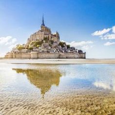 an image of a castle in the middle of water