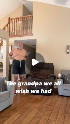 an old man is standing in the living room with his shirt off and no pants on