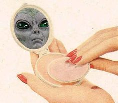 an alien looking through a magnifying glass in someone's hand with red nails