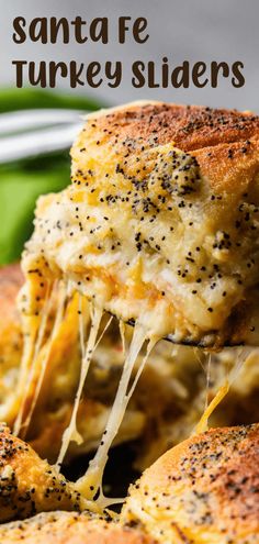 a close up of a piece of bread with cheese and black pepper sprinkled on it