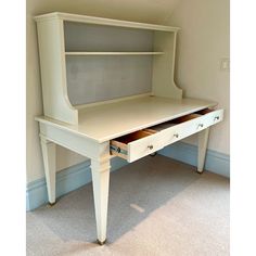 a white desk with drawers underneath it