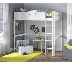 a white bunk bed sitting in a bedroom next to a yellow rug