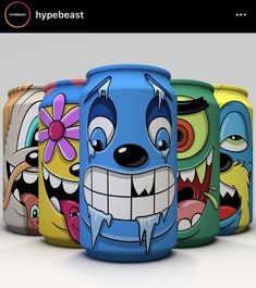 five different colored cans with cartoon characters painted on the sides and one has a flower in its mouth