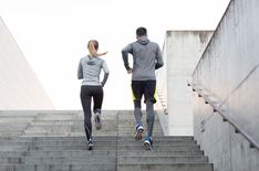 two people are running up some stairs together and there is no image here to provide a caption for