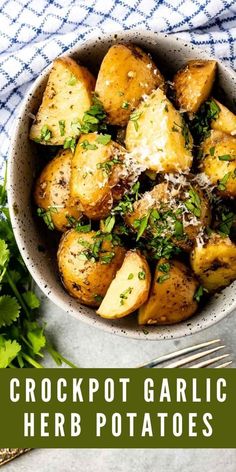 a white bowl filled with cooked garlic mashed potatoes and parsley on the side