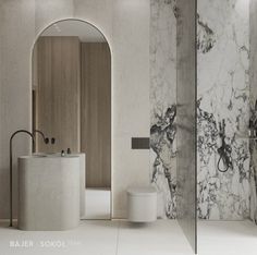 a bathroom with marble walls and flooring