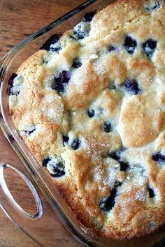 blueberry cobbler in a glass baking dish on a wooden table with four different pictures