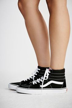 Timelessly classic kicks, these Vans Sk8-Hi sneakers feature a high-top silhouette that effortlessly lace-up. Sturdy rubber sole for ultra comfy wear.