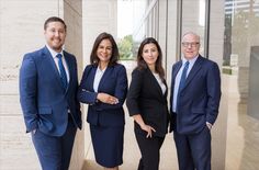 three business people standing in front of a building