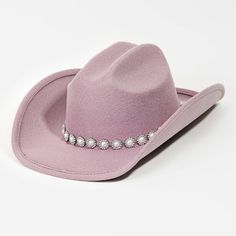 Expertly crafted with a stylish lavender color and studded with beautiful pearls, this fashion cowboy hat is a must-have accessory for any trendsetter. Elevate your outfit with this unique piece that effortlessly adds a touch of sophistication and edge. Elevate Your Outfit, Hat Bands, Holiday 2024, Stud Fashion, Everything Pink, Lavender Color, Your Outfit, Hat Band