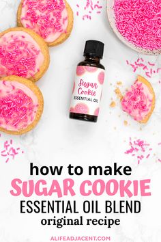 Sugar cookie essential oil in glass dropper bottle surrounded by pink frosted sugar cookies and pink sprinkles. Text overlay: how to make sugar cookie essential oil blend original recipe. Dessert Essential Oil Blends, How To Smell Like Sugar Cookies, How To Smell Like Cookies, Sugar Cookie Essential Oil Blend, Gingerbread Essential Oil Recipe, Body Oil Diy, Body Oil Recipe, Diy Sugar Cookies, Diy Essential Oil Recipes