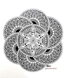 a black and white drawing of an intricate flower