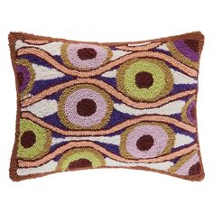 a decorative pillow with an eye design on it