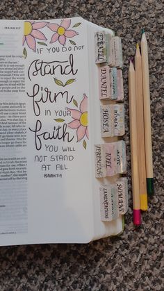 an open bible with pencils and erasers on the floor next to it that says, if you do not stand firm in your faith