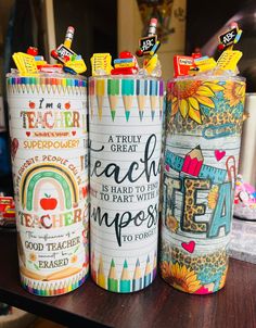 three colorful canisters are sitting on a table with teacher appreciation written on them