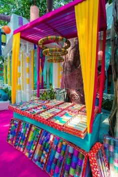 an outdoor area with colorful fabrics and decorations