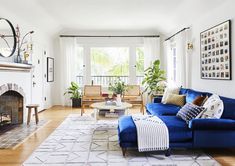 a living room filled with furniture and a fire place