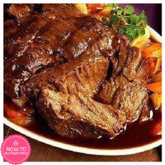 steak and carrots on a plate with gravy