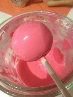 a pink cake pops in a glass bowl