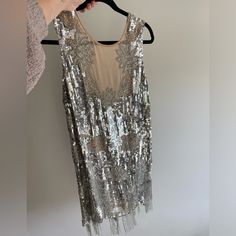 It Pains Me To Part With This Beautiful Dress But I Hope Someone Else Can Get More Wear Out Of It! Some Beads And Sequins Are Missing But Not Noticeable. There Is A Tan Slip Sewn Inside. Backless, Tan Panel On The Front. Make An Offer! Speakeasy Party, Dresses Silver, Fringe Flapper Dress, Sequin Party, Sequin Party Dress, Asos Dresses, Size 12 Dress, Silver Sequin, Beautiful Dress