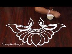 a person standing on top of a wooden floor next to a white rangdi design