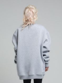 Elevate your casual wardrobe with the chic simplicity of our Relaxed Fit Viscose Sweatshirt. Crafted from luxuriously soft and sustainable viscose fabric, this sweatshirt offers an eco-friendly option that does not compromise on style or comfort. Designed for the modern woman on the go, the light heather grey hue complements a wide array of looks, seamlessly transitioning from your morning run to a casual coffee date.. FEATURES:A relaxed, oversized silhouette for a modern and effortless style. The drop shoulder design adds a laid-back charm, while the ribbed cuffs provide structure to the loose form.100% Handmade. SIZE & FIT: Fit: A relaxed fit with room to moveModel is wearing size Small or S/M View our SIZE CHART before ordering MATERIALS & CARE: Content: 65% Cotton, 35% Polyester Care: Oversized Silhouette, Workout Sweatshirt, Viscose Fabric, The Chic, Casual Wardrobe, Jacket Outfits, Modern Woman, Effortless Style, Heather Grey