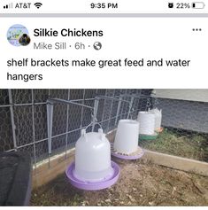 two plastic jugs sitting next to each other in front of a chicken coop fence