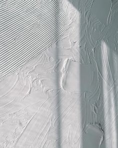 the shadow of a person skiing down a snow covered slope