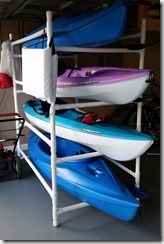 three kayaks are stacked on top of each other