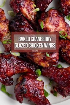 baked cranberry glazed chicken wings on a white plate with the words baked cranberry glazed chicken wings