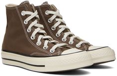 High-top canvas sneakers in brown. · Rubber cap toe · Lace-up closure · Eyelets and logo patch at inner side · Padded Ortholite™ footbed · Rubberized logo patch at heel · Treaded rubber sole · Contrast stitching in white Supplier color: Squirrel friend/Egret/Black Brown Chuck 70, Converse Brown, Chuck 70, Next Clothes, Converse Sneakers, Sneaker Collection, Sportswear Women, Canvas Sneakers, Contrast Stitch