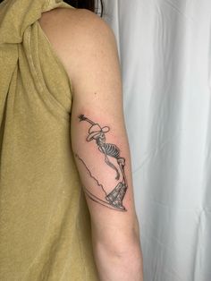 a woman with a tattoo on her arm