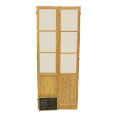 an old wooden door with a chalkboard attached to it's front and side panels