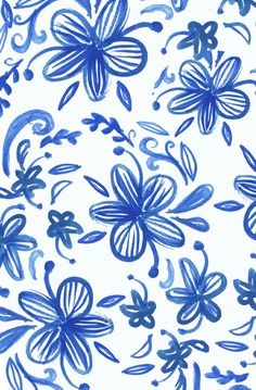 blue flowers and swirls painted on white paper