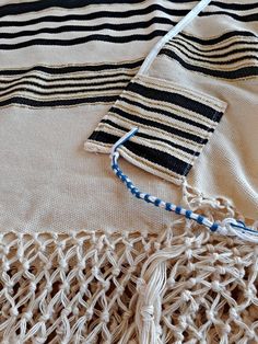 "A Jewish woven prayer shawl. Jewish man's prayer shawl (tallit in Hebrew) is made of cotton. This tallit is a traditional Yemenite tallit that has a combination of black, gold, and white. The tallit is handwoven from fine cotton on traditional looms by Jewish men in Israel. The tzitzit are tied by the Yemenite tradition. You can add a matching tallit bag: https//www.etsy.com/listing/849486860/ You can add matching kippah// yarmulke: https://www.etsy.com/listing/867562773/ Purchase this elegant Hebrew Blessing, Jewish Prayer, High Holidays, Jewish Men, Prayer Shawl, Sewing Workshop, Jewish Jewelry, Jewish Gifts, Jewish Art