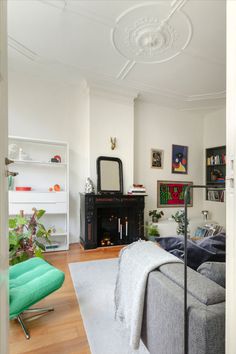 a living room filled with furniture and a fire place