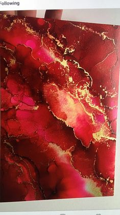 an abstract painting with red and gold colors