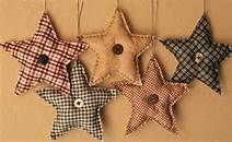 five star shaped ornaments hanging on a wall