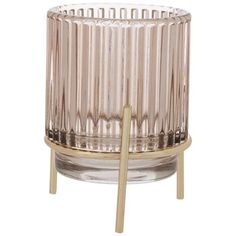 a clear glass candle holder with a wooden stick sticking out of the top, on a white background