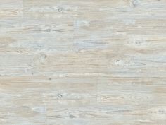 a white wood floor textured with light brown paint