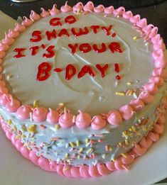 a birthday cake with white frosting and pink sprinkles that says, go shanty it's your b - day