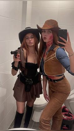 two women dressed up as zombies in a bathroom