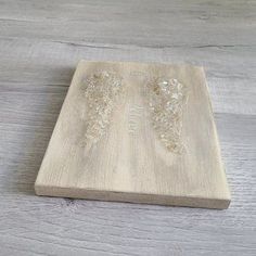 a wooden board with some glass beads on it