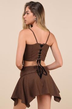 Cozy fall vibes meet fashion-forward style in the Zemeta Pinstriped Brown Fuzzy Handkerchief Mini Skirt! This unique skirt features soft, fuzzy knit fabric that shapes a notched, fold-over waistband that can be styled as mid or low-rise. Lightweight woven fabric (with a classic pinstriped design) creates a mini skirt that falls to an angled, handkerchief hem for a trend-setting finish! Pair with the matching top for a complete look! Fit: This garment runs small - please size up. Length: Mid-thig Knit Bow, Unique Skirts, Brown Pinstripe, European Summer Outfits, Casual Bottoms, Straight Neckline, Cropped Cami, Cami Crop Top, Velvet Ribbon